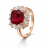 Rose Gold-Tone Cushion Cut Red Stone Ring with Floral Halo Design
