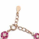 Elegant Gold Tone Floral Bracelet with Pink Stone Cluster Design