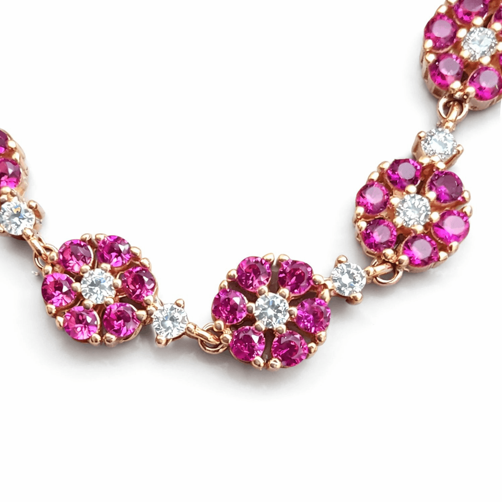 Elegant Gold Tone Floral Bracelet with Pink Stone Cluster Design