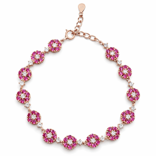 Elegant Gold Tone Floral Bracelet with Pink Stone Cluster Design